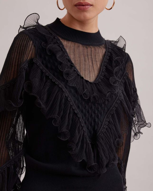 Anne Fontaine vrouwen oeuvre top, gebreid met lange mouwen, transparante details en uitlopende ruches kleding zwart 06TRT289